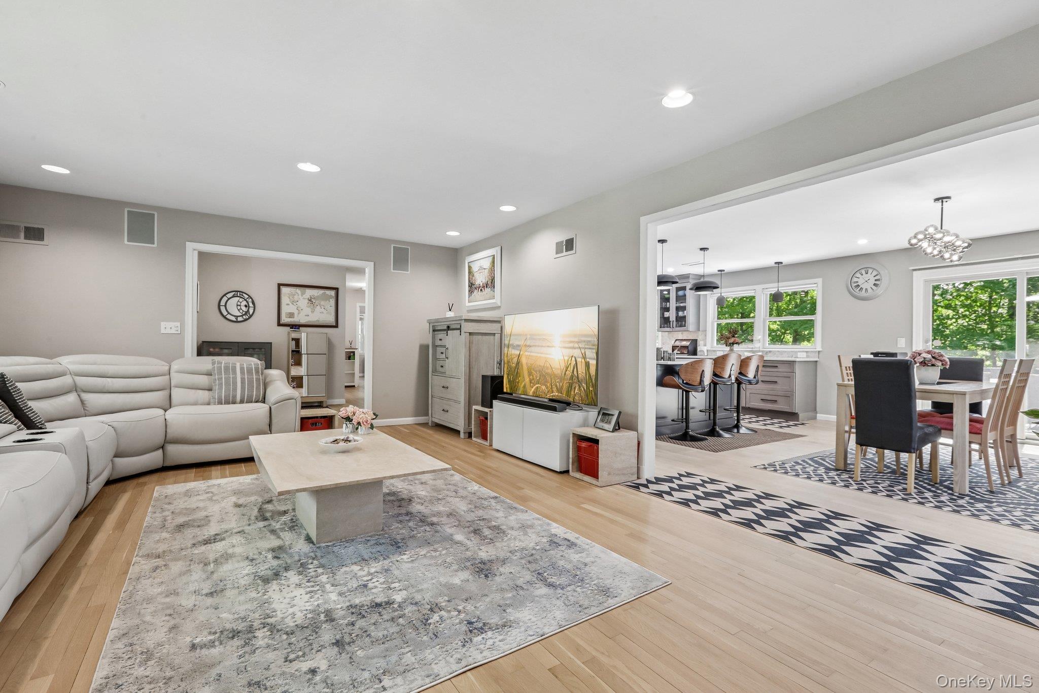 62 Mohegan Road Larchmont, NY 10538 - Photo 16 of 46 a living room with furniture and a flat screen tv