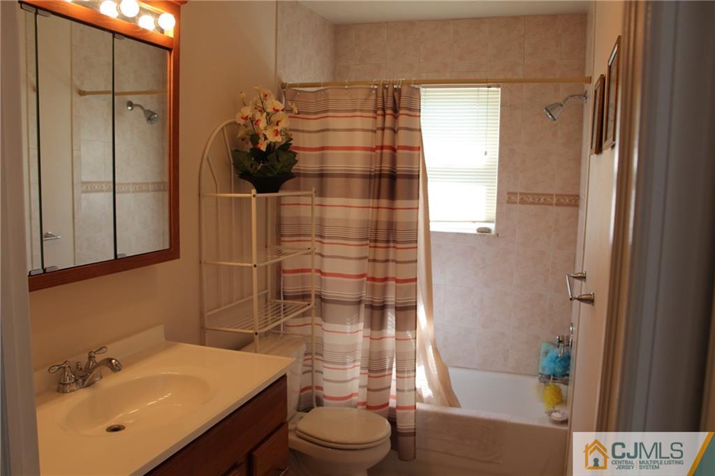 1 Parkerson Road Edison, NJ 08817 - Photo 14 of 19 a bathroom with a sink toilet and shower