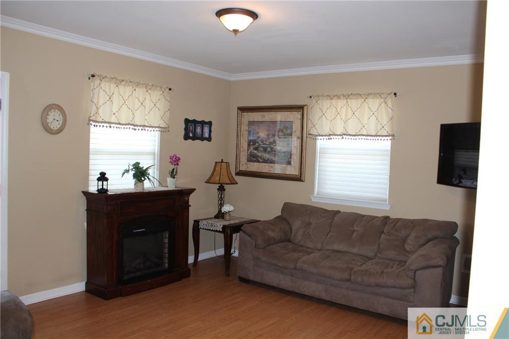 1 Parkerson Road Edison, NJ 08817 - Photo 3 of 19 a living room with furniture and a window
