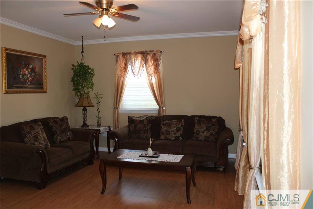1 Parkerson Road Edison, NJ 08817 - Photo 8 of 19 a living room with furniture and a window