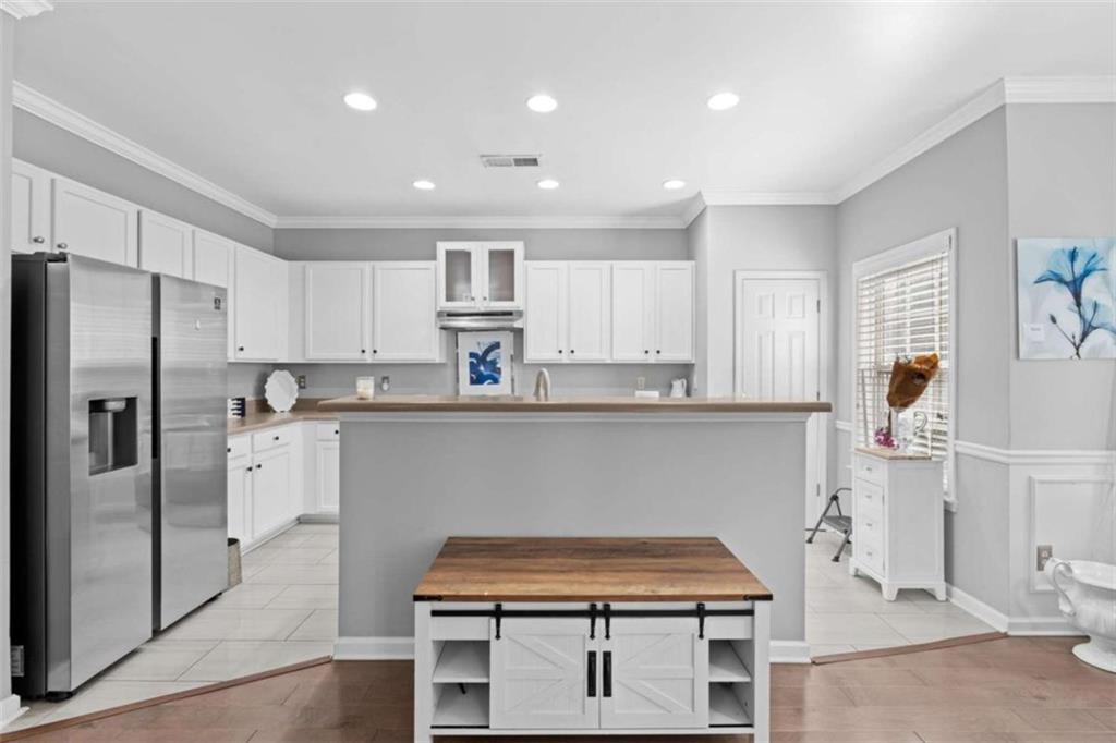 7200 Suttles Drive Southwest South Fulton, GA 30331 - Photo 12 of 44 a kitchen with stainless steel appliances a refrigerator and a stove top oven