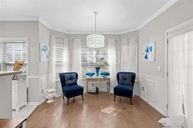 a view of a livingroom with furniture window and wooden floor