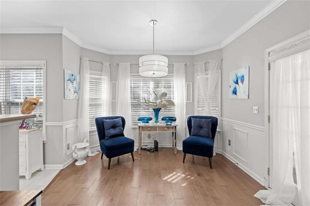 7200 Suttles Drive Southwest South Fulton, GA 30331 - Photo 13 of 44 a view of a livingroom with furniture window and wooden floor