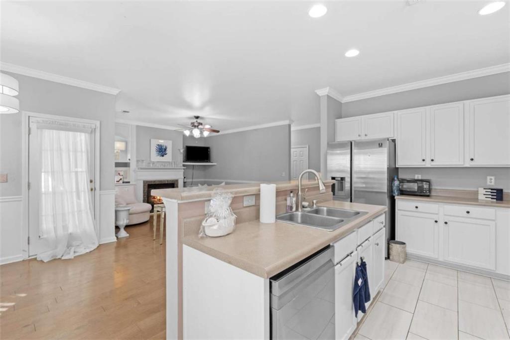 7200 Suttles Drive Southwest South Fulton, GA 30331 - Photo 16 of 44 a kitchen that has a lot of white cabinets and stainless steel appliances