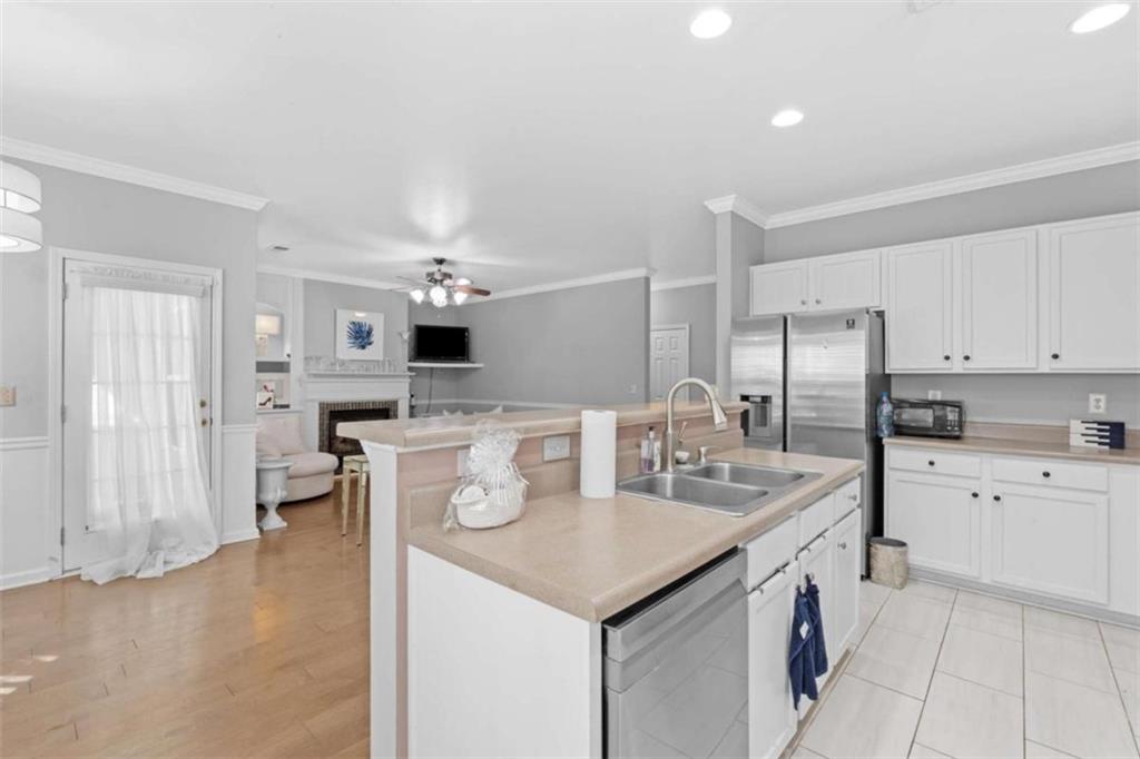 7200 Suttles Drive Southwest South Fulton, GA 30331 - Photo 17 of 44 a kitchen that has a lot of white cabinets and stainless steel appliances