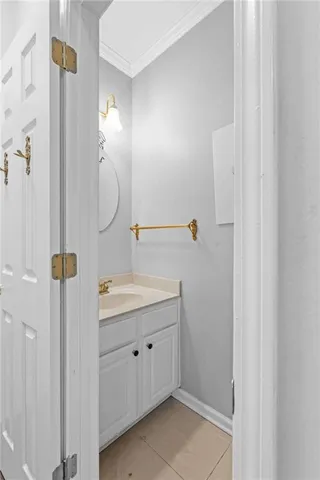 a bathroom with a granite countertop sink a toilet and a mirror