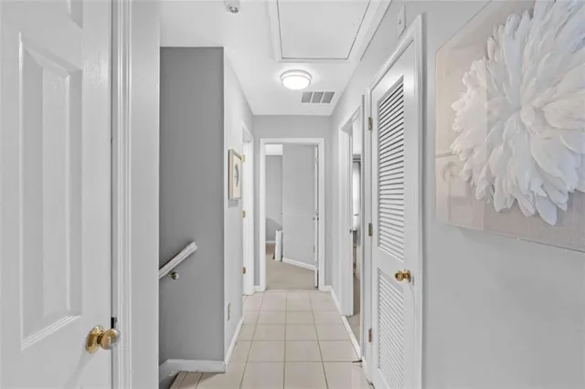 a view of a hallway with wooden shelves