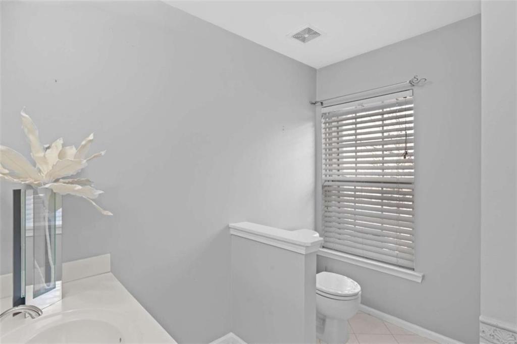 7200 Suttles Drive Southwest South Fulton, GA 30331 - Photo 28 of 44 a bathroom with a toilet a sink and mirror