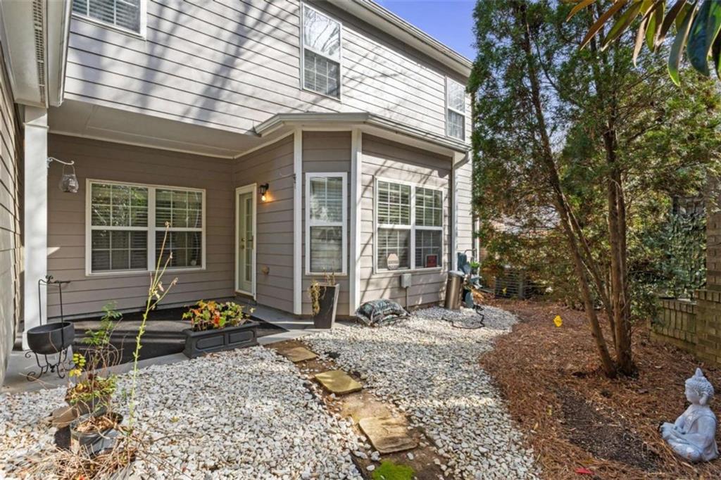 7200 Suttles Drive Southwest South Fulton, GA 30331 - Photo 5 of 44 a front view of a house with a yard