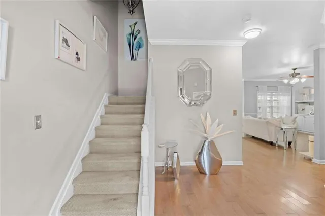 a view of entryway and hall with wooden floor