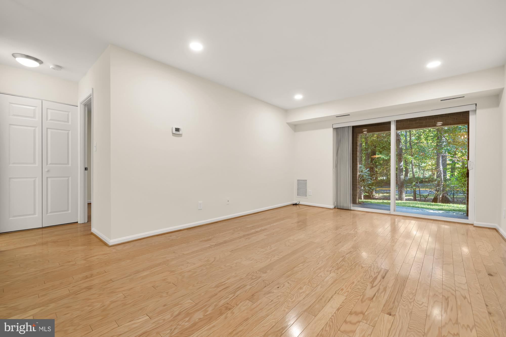 5932 Cove Landing Road, Unit 101 Burke, VA 22015 - Photo 3 of 45 spacious living room overlooks private patio