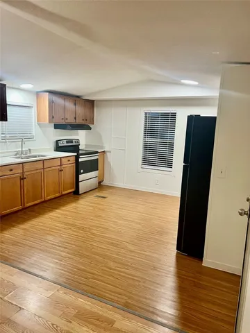 a view of a kitchen with microwave and stove