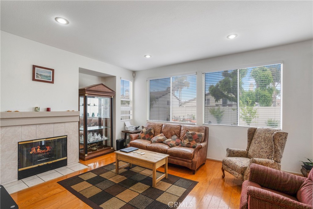 8946 Burlington Circle Riverside, CA 92508 - Photo 11 of 26 a living room with furniture and a fireplace
