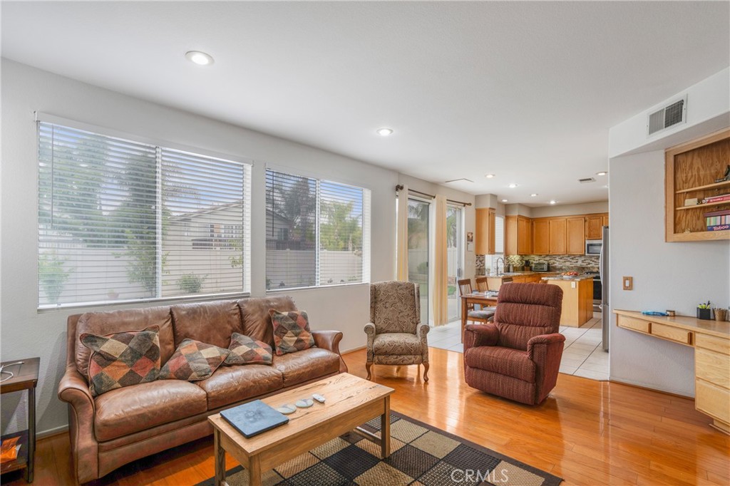 8946 Burlington Circle Riverside, CA 92508 - Photo 12 of 26 a living room with furniture and a large window