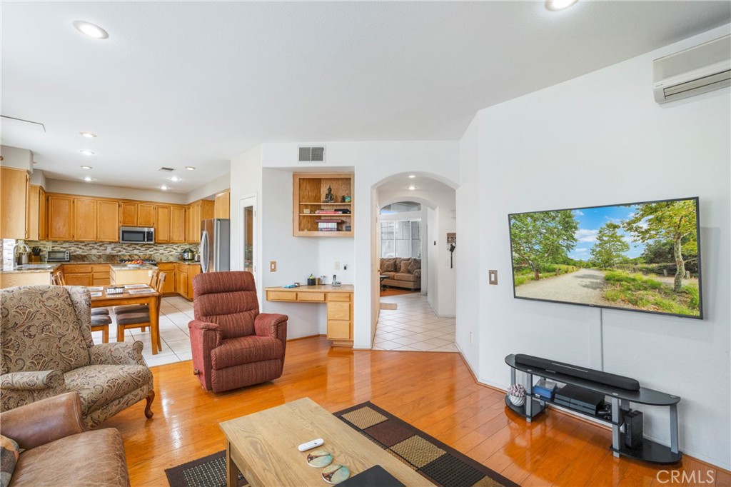 8946 Burlington Circle Riverside, CA 92508 - Photo 14 of 26 a living room with furniture and a flat screen tv