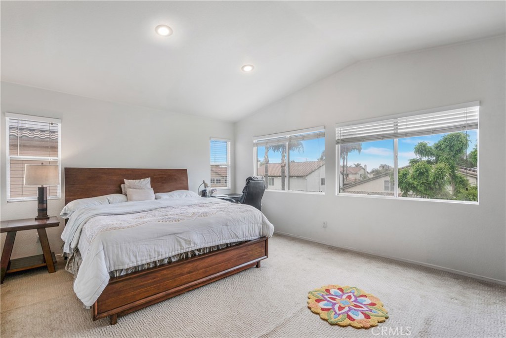 8946 Burlington Circle Riverside, CA 92508 - Photo 18 of 26 a bedroom with a large bed and a large window