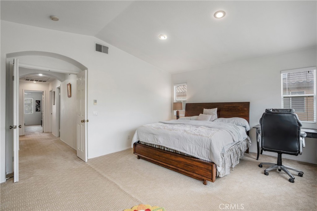 8946 Burlington Circle Riverside, CA 92508 - Photo 19 of 26 a bedroom with a bed and a chair