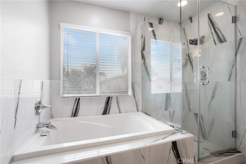 8946 Burlington Circle Riverside, CA 92508 - Photo 21 of 26 a bathroom with a sink and a bathtub