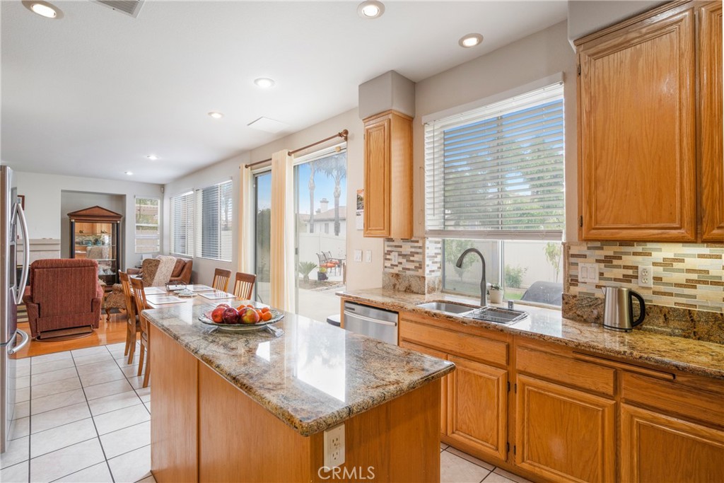 8946 Burlington Circle Riverside, CA 92508 - Photo 4 of 26 a kitchen with sink stove and cabinets