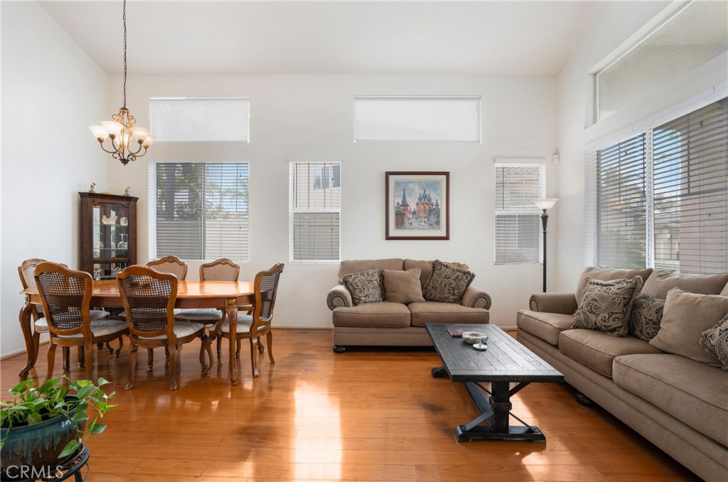 8946 Burlington Circle Riverside, CA 92508 - Photo 10 of 26 a living room with furniture wooden floor and dining table