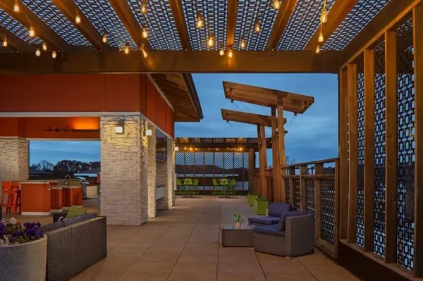 a view of a patio with a table and chairs