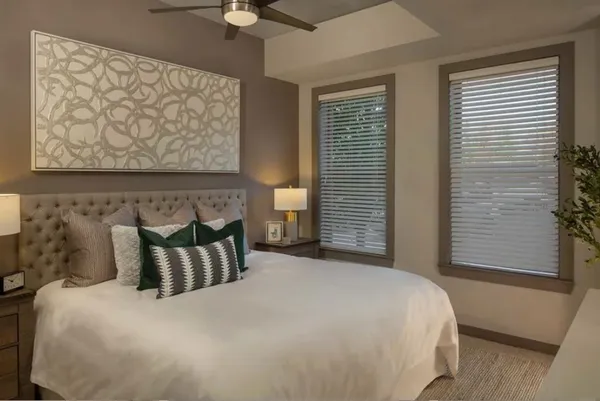 a bedroom with a bed and window