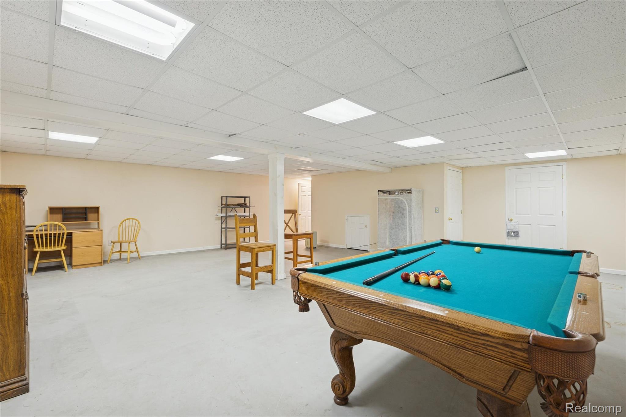 3031 Cedar Point Howell, MI 48843 - Photo 33 of 51 Playroom with pool table and a drop ceiling