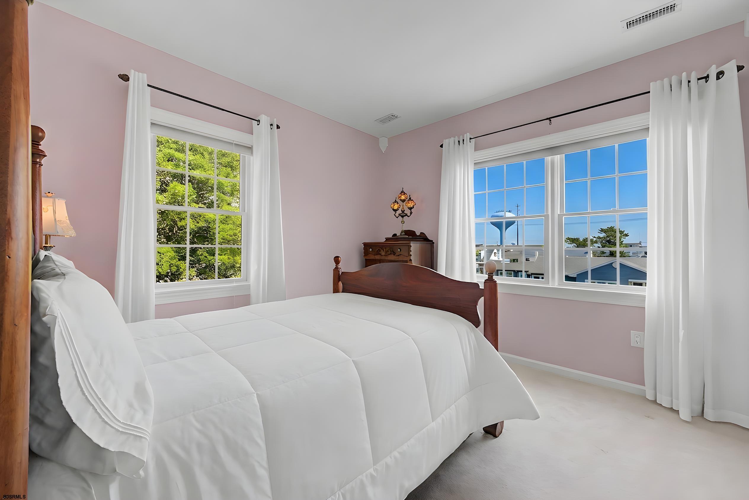 212 17th Street South Brigantine, NJ 08203 - Photo 28 of 37 a bedroom with a bed and a window