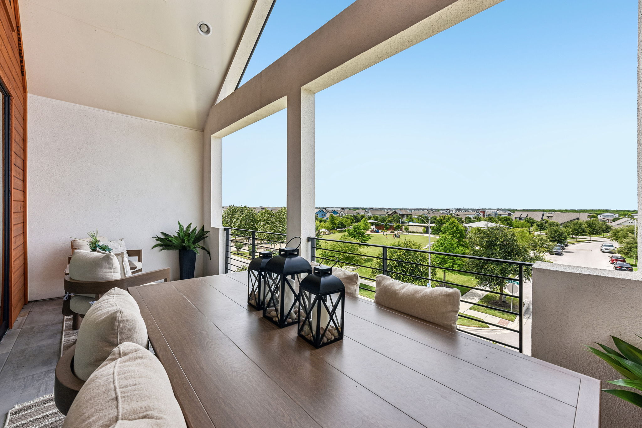 9101 Cattle Baron Path Austin, TX 78747 - Photo 36 of 40 Unwind outdoors on this charming balcony, offering scenic views of the community green space.