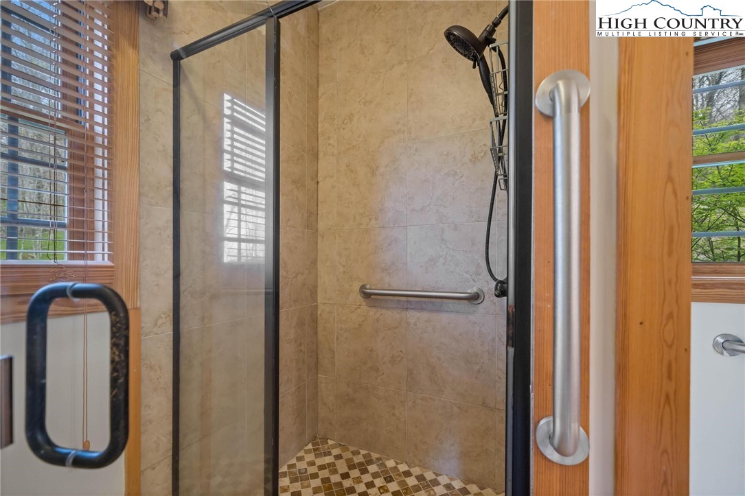 140 Spruce Hollow Road Beech Mountain, NC 28604 - Photo 20 of 50 a bathroom with a shower