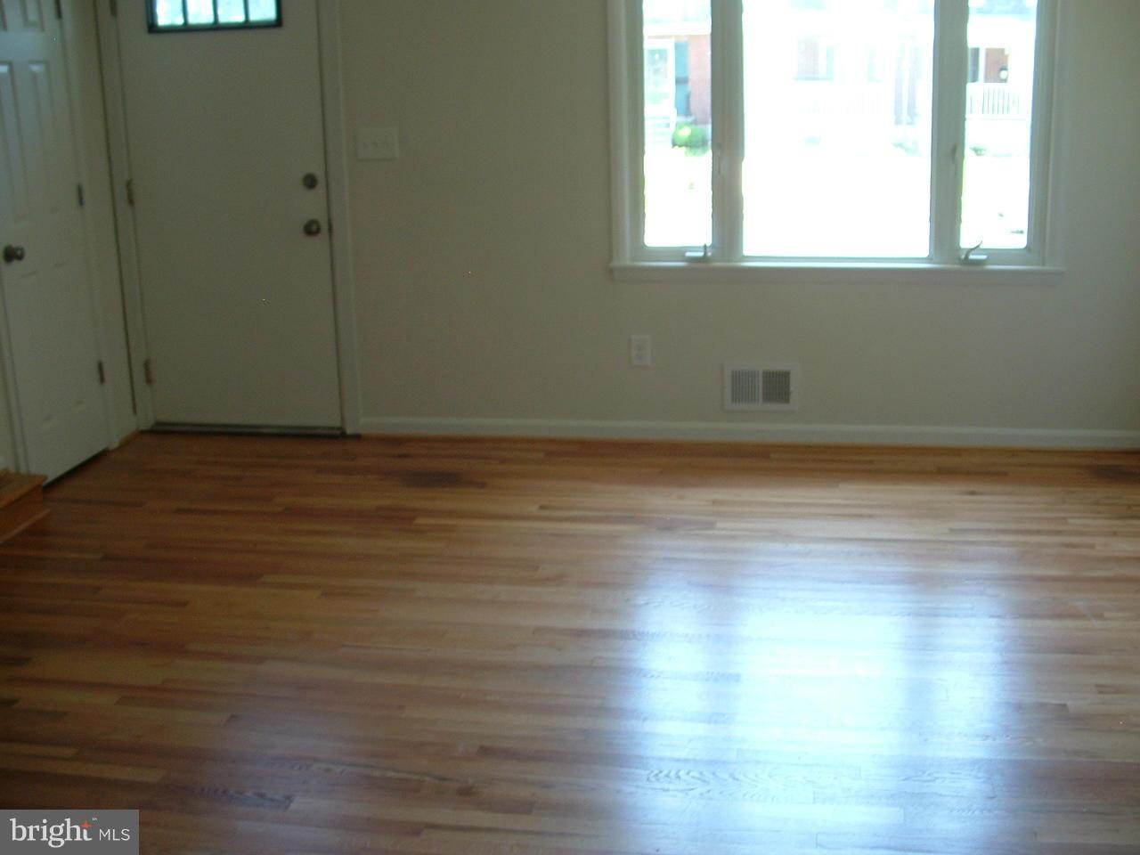 2129 Cockspur Road Baltimore, MD 21220 - Photo 14 of 27 a view of a room with wooden floor and window