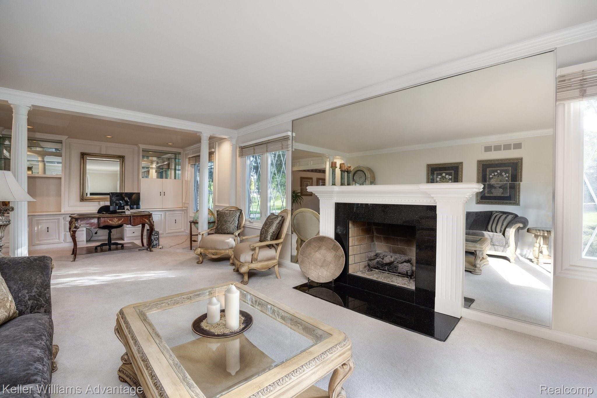 38125 Hayes Road Sterling Heights, MI 48313 - Photo 8 of 83 Stone surround fireplace flanked by harlequin windows