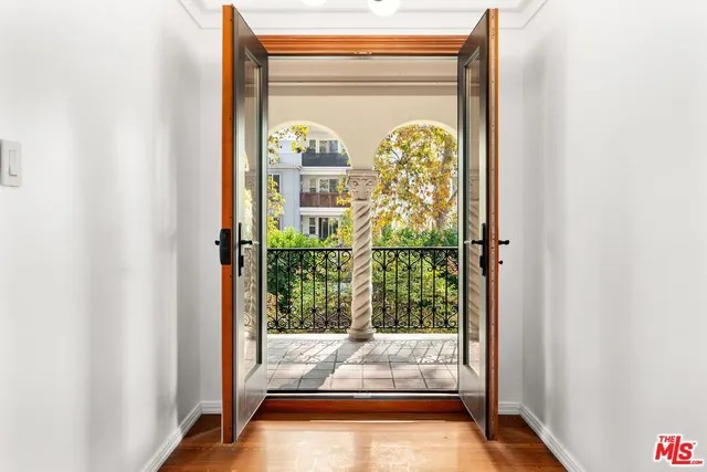 a view of a porch with a floor to ceiling window