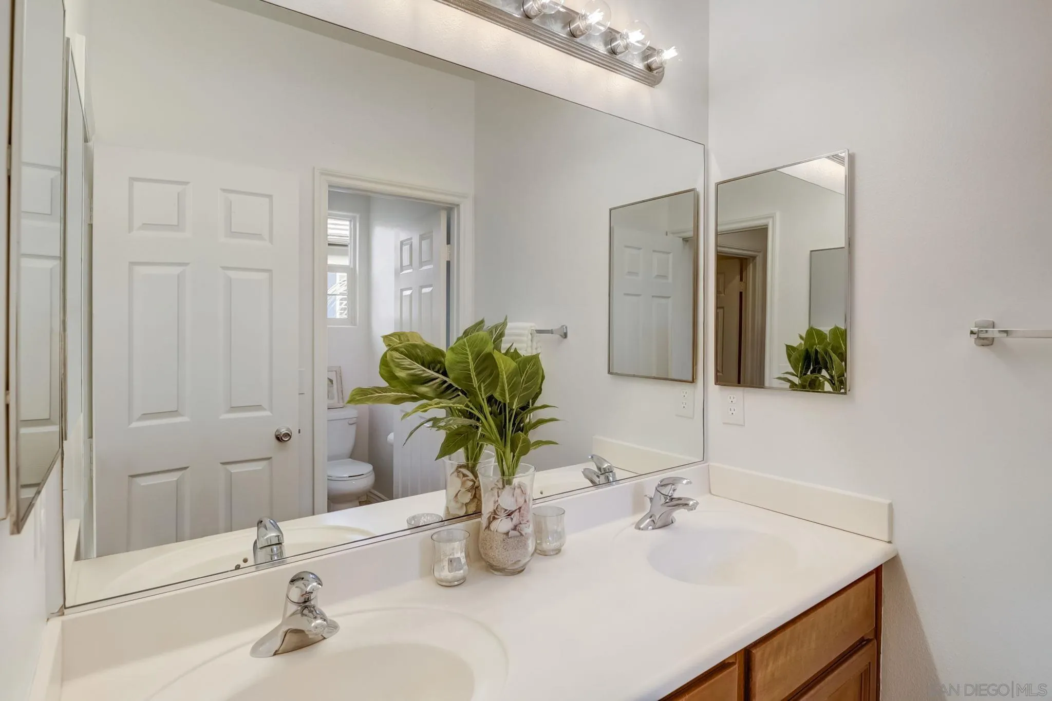 648 Beach Street Encinitas, CA 92024 - Photo 18 of 31 a bathroom with a sink and a mirror