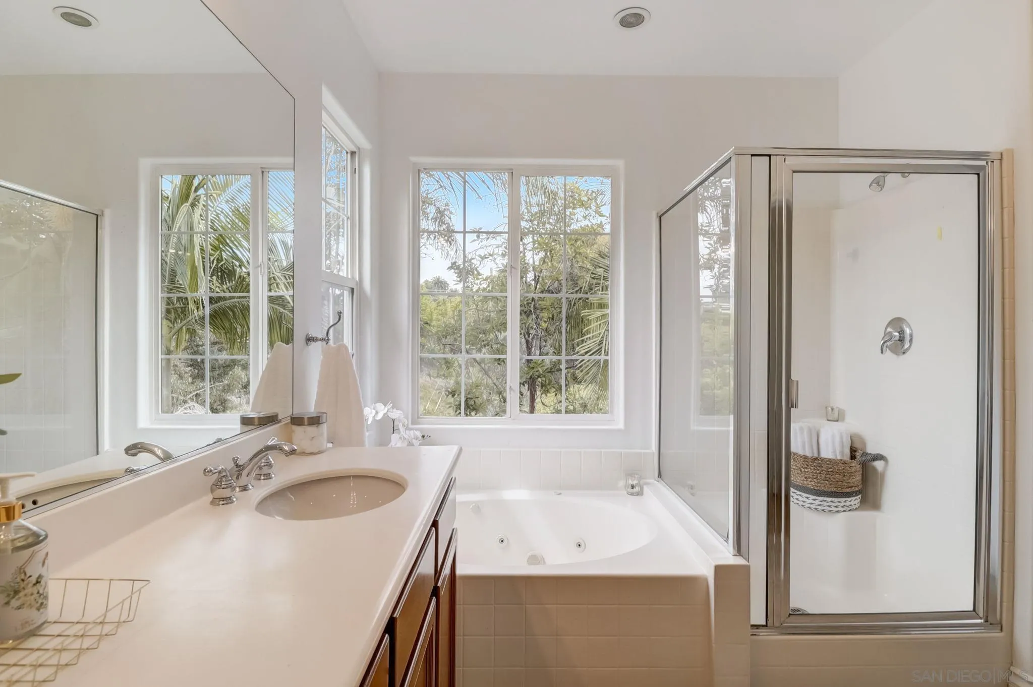 648 Beach Street Encinitas, CA 92024 - Photo 22 of 31 a bathroom with a sink a mirror and a shower
