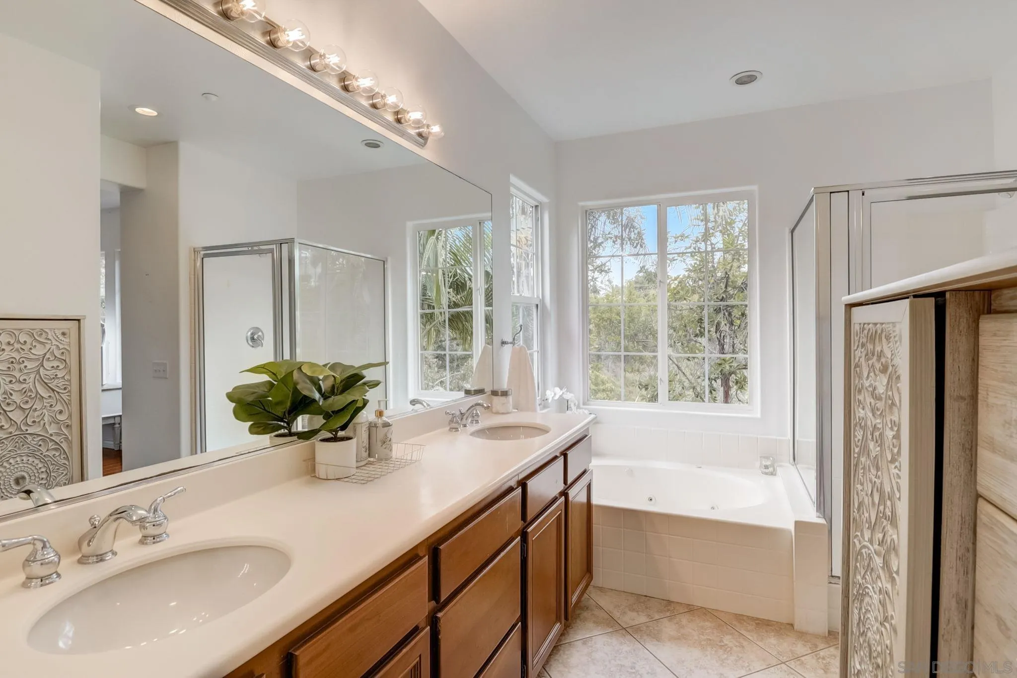 648 Beach Street Encinitas, CA 92024 - Photo 23 of 31 a bathroom with a tub sink and mirror
