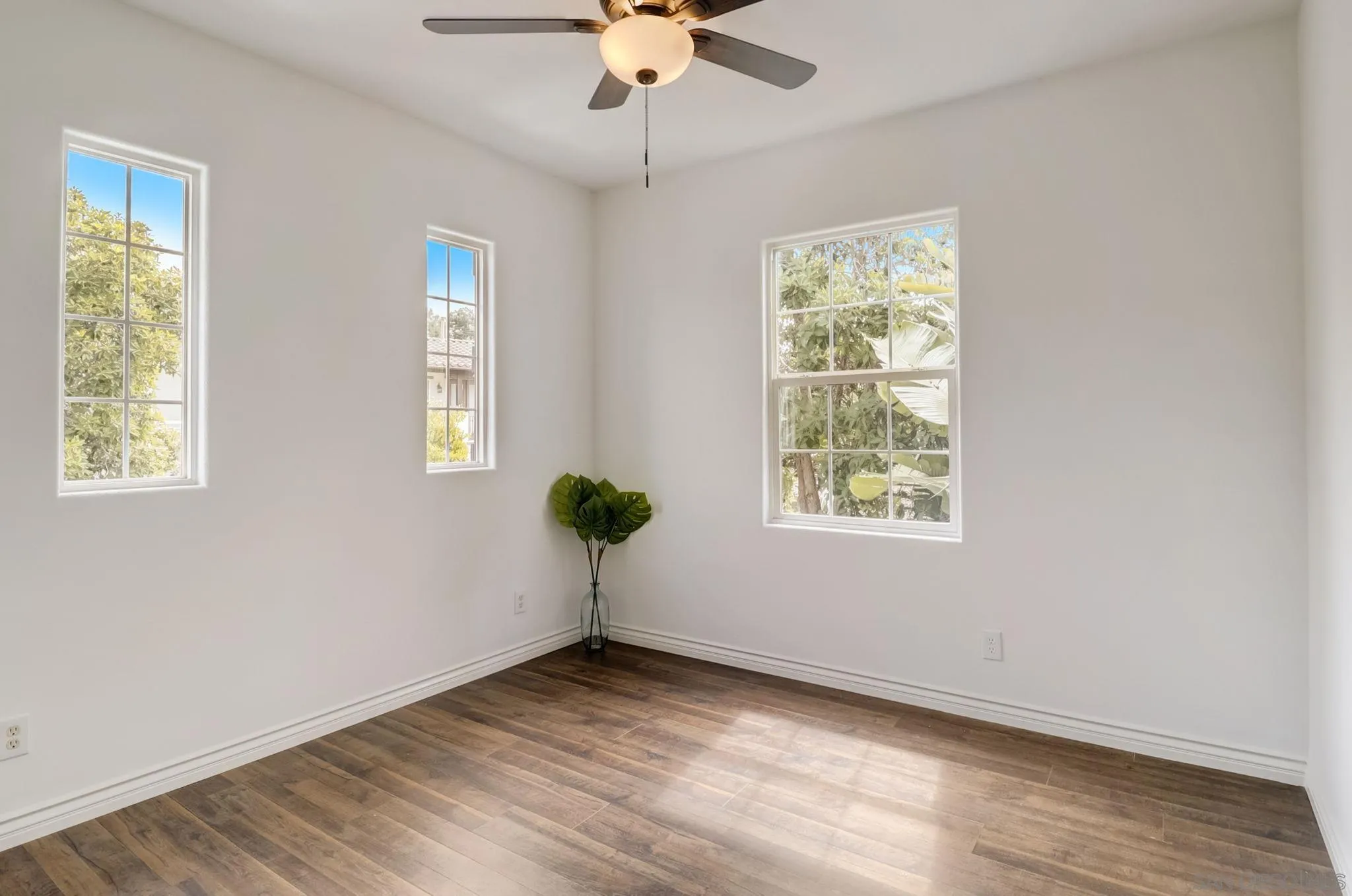 648 Beach Street Encinitas, CA 92024 - Photo 24 of 31 a view of an empty room with window and wooden floor