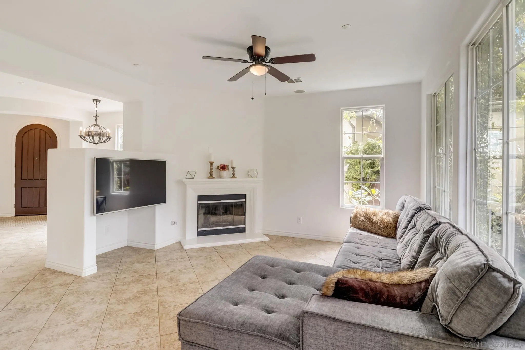 648 Beach Street Encinitas, CA 92024 - Photo 8 of 31 a living room with furniture and a flat screen tv