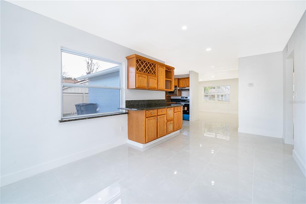 146 Exeter Avenue Longwood, FL 32750 - Photo 11 of 25 a kitchen with stainless steel appliances a refrigerator and a stove
