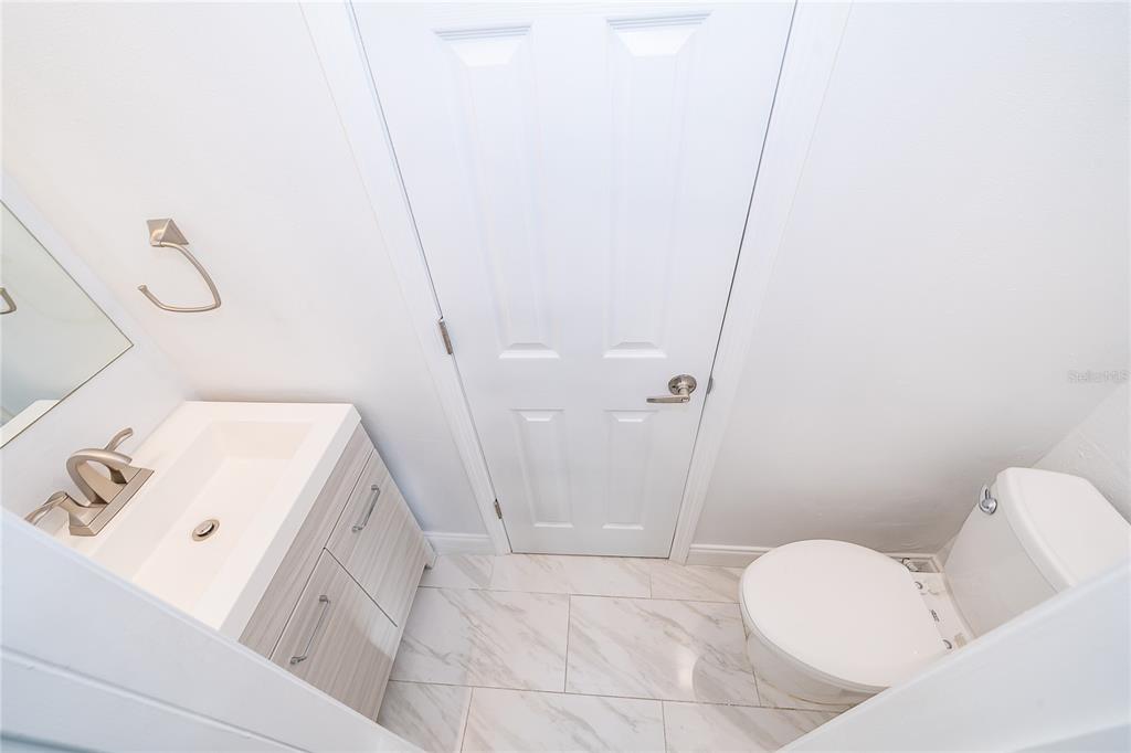 146 Exeter Avenue Longwood, FL 32750 - Photo 17 of 25 a bathroom with a sink and toilet