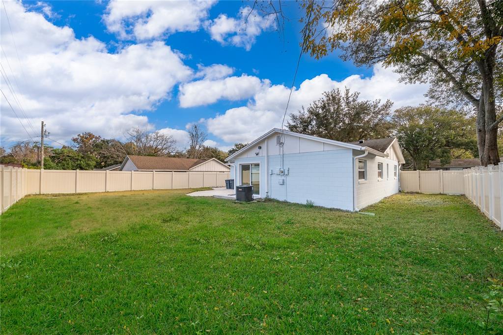 146 Exeter Avenue Longwood, FL 32750 - Photo 25 of 25 a view of a backyard with a garden