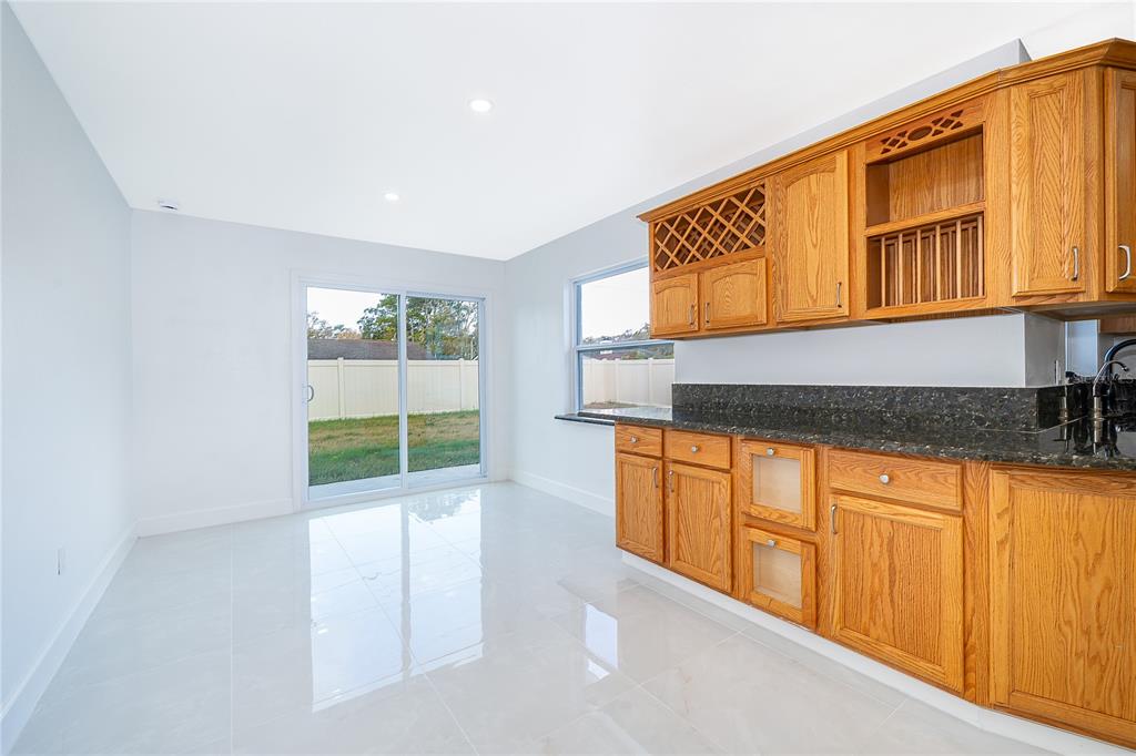 146 Exeter Avenue Longwood, FL 32750 - Photo 10 of 25 a kitchen with stainless steel appliances granite countertop a sink and cabinets
