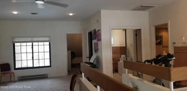 a room with gym equipment and a mirror