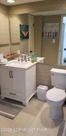 a bedroom with bed and window