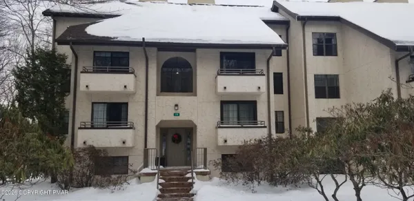 a front view of a house with yard