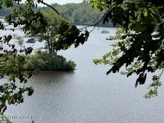 a couple of blue and white water sitting next to a lake