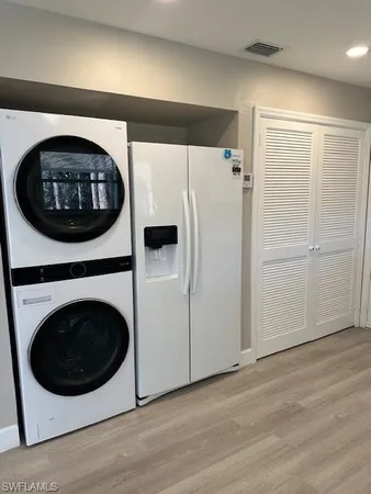 a view of a hallway with washer and dryer