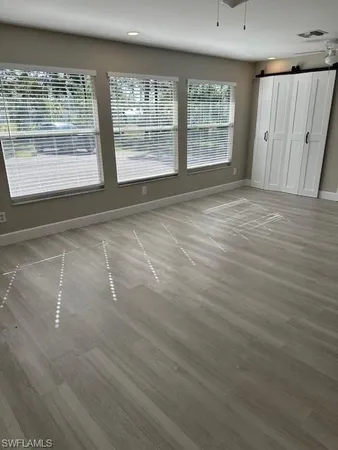 a view of an empty room with a window