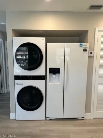 a view of a hallway with washer and dryer
