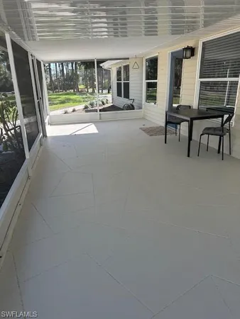 a view of swimming pool with seating space